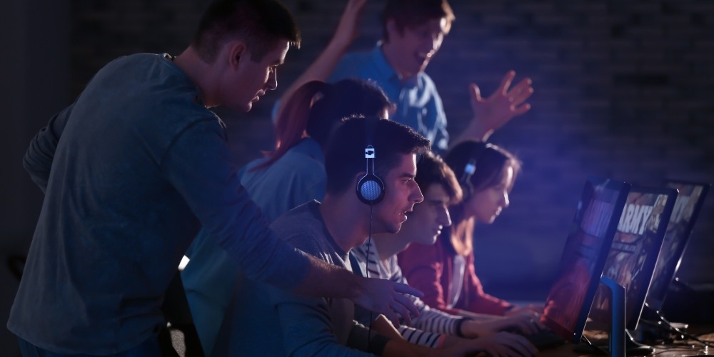 young people playing a video game